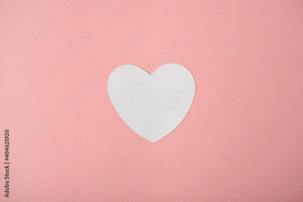 Paper heart over the rose pastel background. Abstract background with paper cut shape. Saint Valentine, mother's day, birthday greeting cards, invitation, celebration concept.