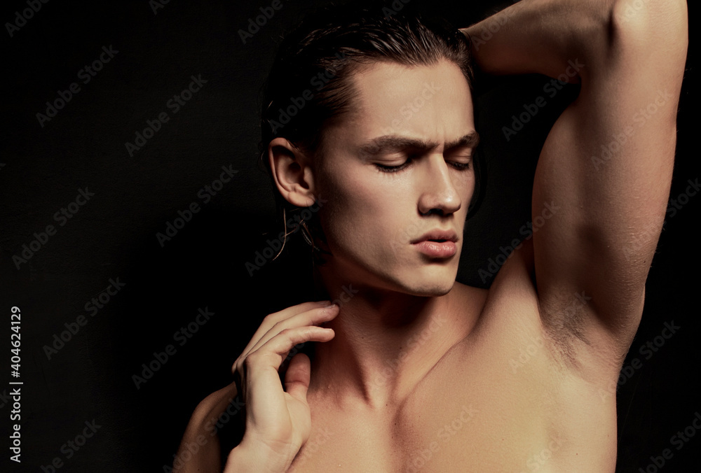 Strong stripped muscle male model in white underwear on black isolated font background Strong stripped muscle male model in white underwear on black isolated font background