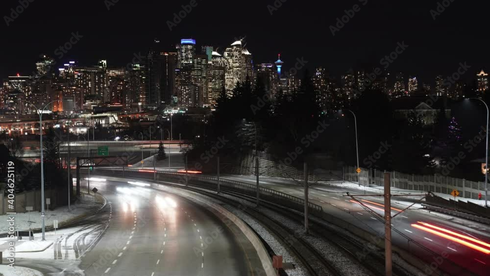 A time lapse of vehicles and their light trails as they leave downtown Calgary Alberta Canada on Bow Trail.