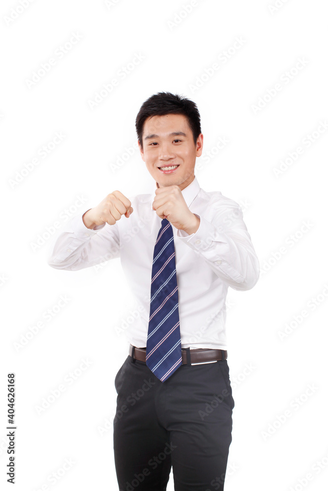 A businessmanin boxing pose and looking at camera A businessmanin boxing pose and looking at camera