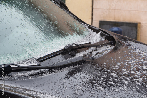 Hail on the windshield of a car during winter in Brittany
