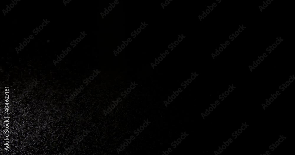 The effect of spraying water on a black background is suitable to replace in your video