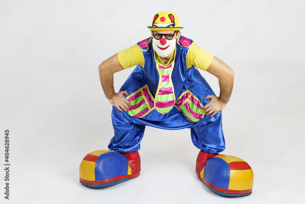 Plakat Clown in a bright suit sat down like a samurai