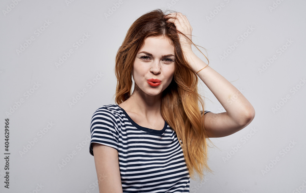 Cheerful pretty woman attractive look striped t-shirt decoration charm model Cheerful pretty woman attractive look striped t-shirt decoration charm model