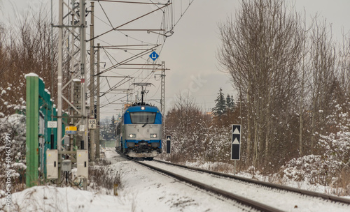Train from Austria to Czech republic near Ceske Budejovice city in snowy day