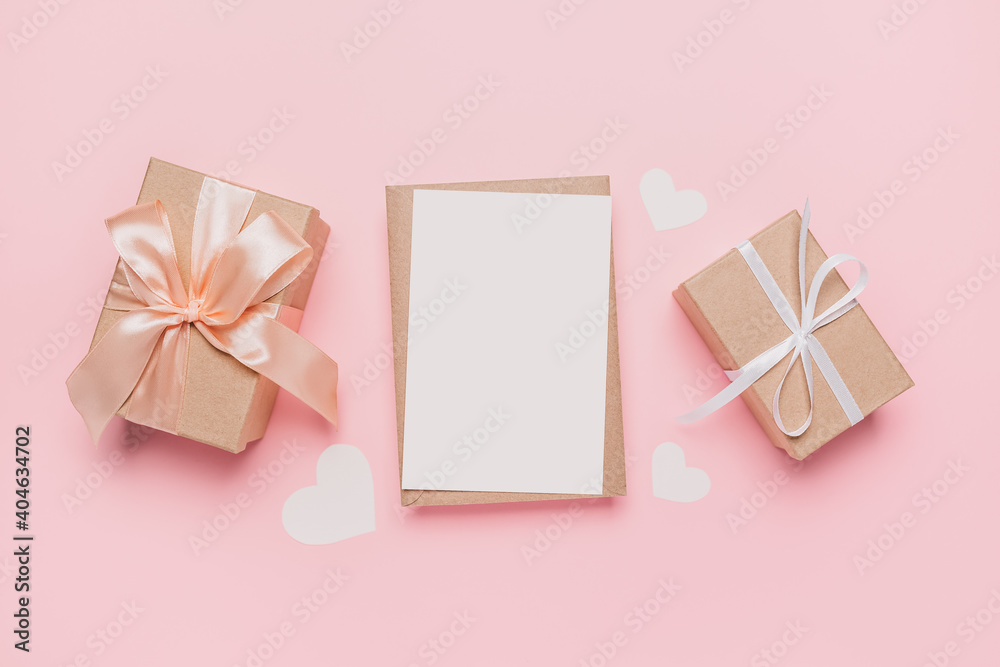 Gifts with note letter on isolated pink background, love and valentine concept