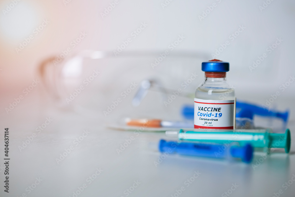 Medical concept of vaccination of hypodermic injection therapy. One vial of Covid-19 vaccine. Best protection for coronavirus. Copy space for text. Medical concept of vaccination of hypodermic injection therapy. One vial of Covid-19 vaccine. Best protection for coronavirus. Copy space for text.