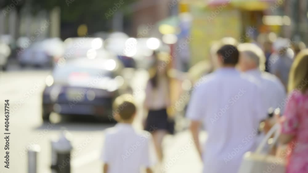 New York City busy street, driving cars and people walk, sunny blurry cityscape New York City busy street, driving cars and people walk, sunny blurry cityscape