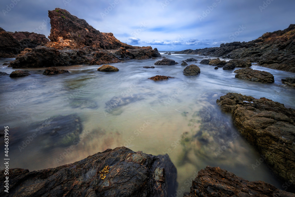 Water pouring in through the rocks at Port Macquarie on NSW mid north coast