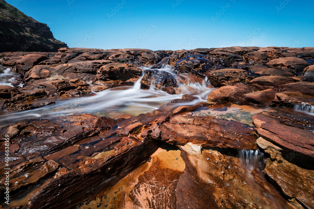 Water on the rocks at Avoca Beach on NSW Central Coast