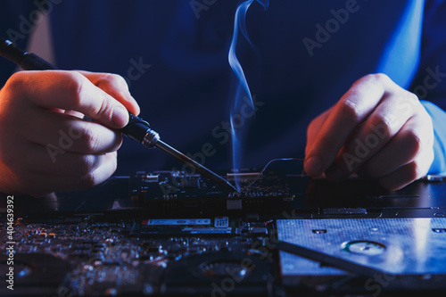 computer hardware engineering. technology science concept. developer soldering electronic component