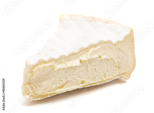 Triangle Slice of a Soft White Cheese with a Rine on a  White Background