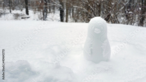 Snow penguin in winter Landscape  building a different snowman