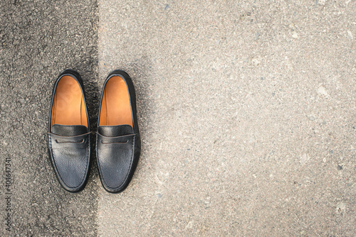 men's shoes moccasins black color. photo on the street