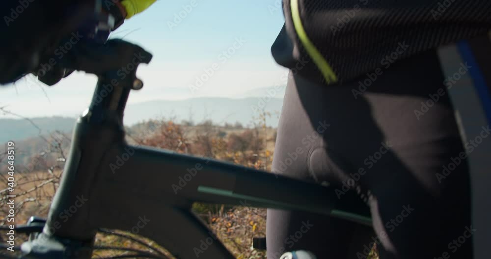Adult male riding his bicycle in the countryside Adult male riding his bicycle in the countryside