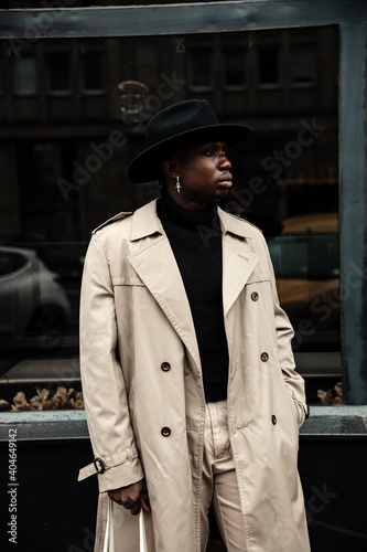  Fashion black man walking on street. Fashionable portrait of african american male model. Street style