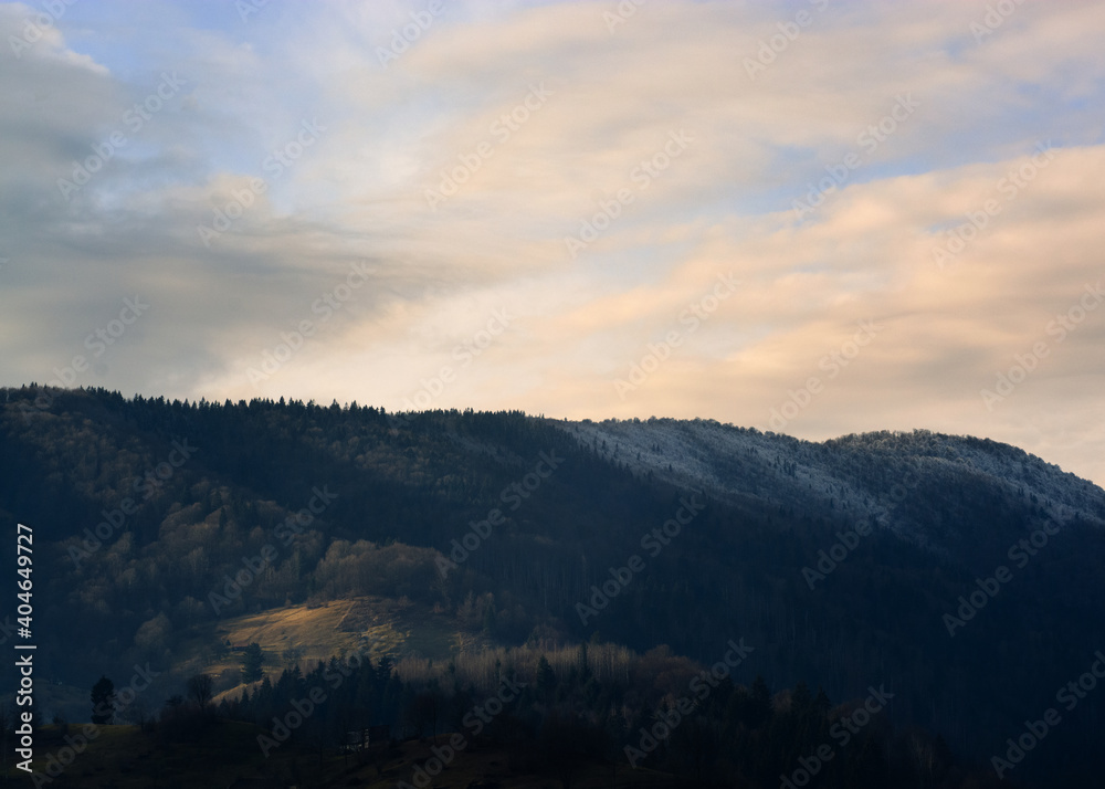 Fototapeta premium landscape with mountains and clouds at sunset