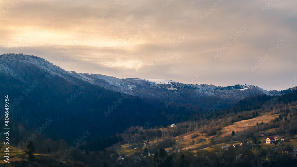 landscape with mountains and clouds at sunset