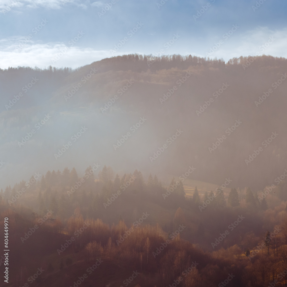 landscape with mountains and clouds at sunrise