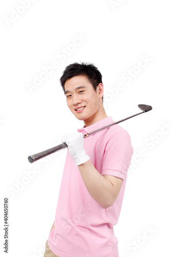 A happy young business man playing golf