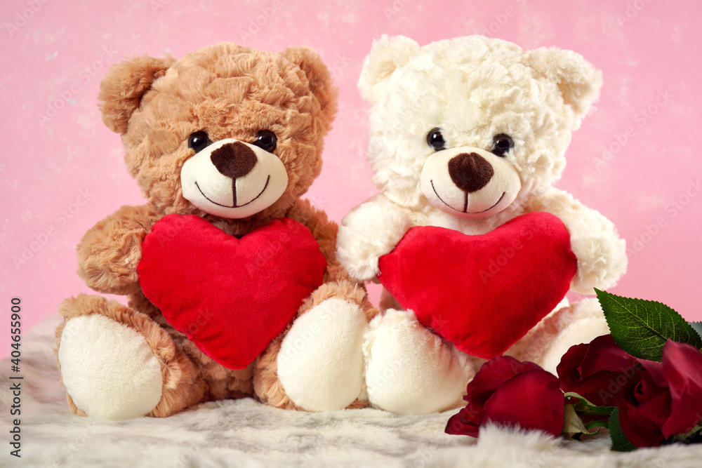 Happy Valentine's Day Teddy Bears With Love hearts gifts on pink and white fur background.
