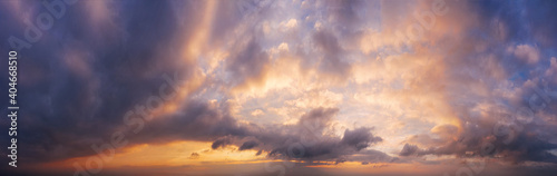 Picturesque panorama of sky with clouds during sunset.