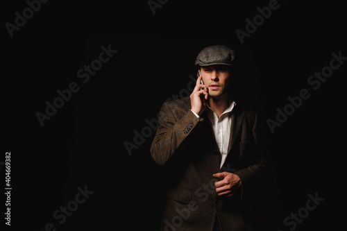 A man in a classic jacket and cap. © vov8000