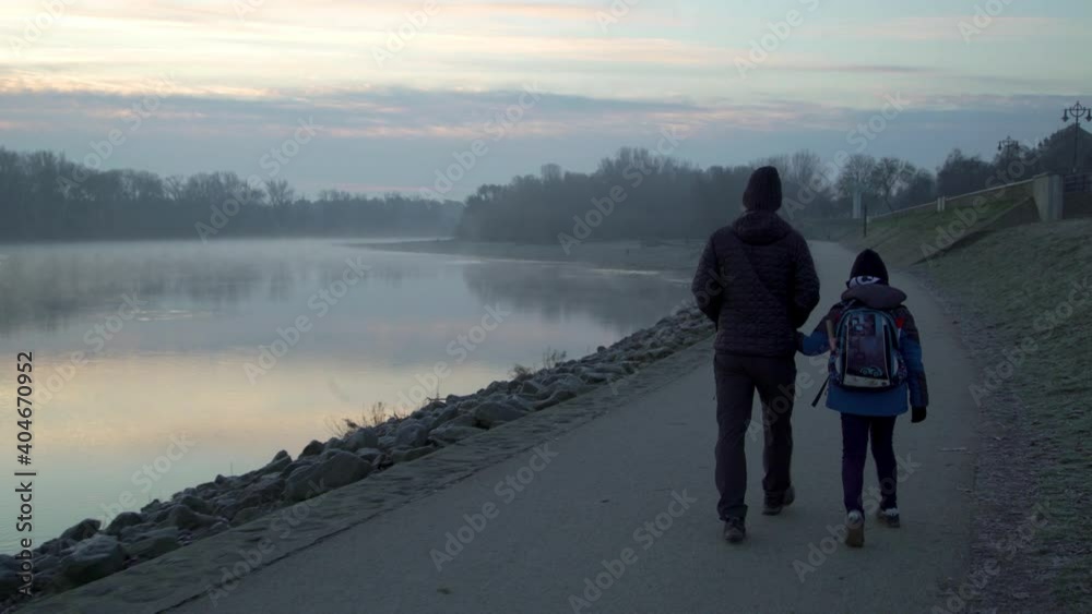 Father with his son go to school on foot. Father with his son go to school on foot.