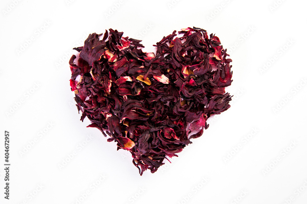 heart made of dried roselle flower on white background, healthy life and nutrition concept