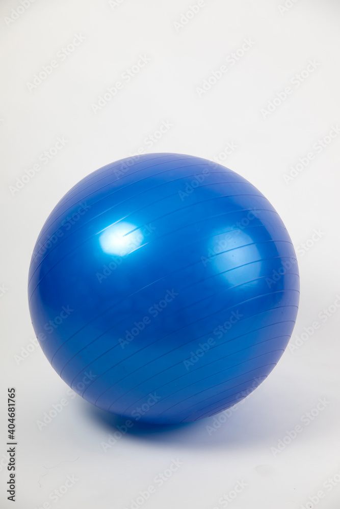 Blue birthing ball on white studio background with copy space. vertical format Blue birthing ball on white studio background with copy space. vertical format