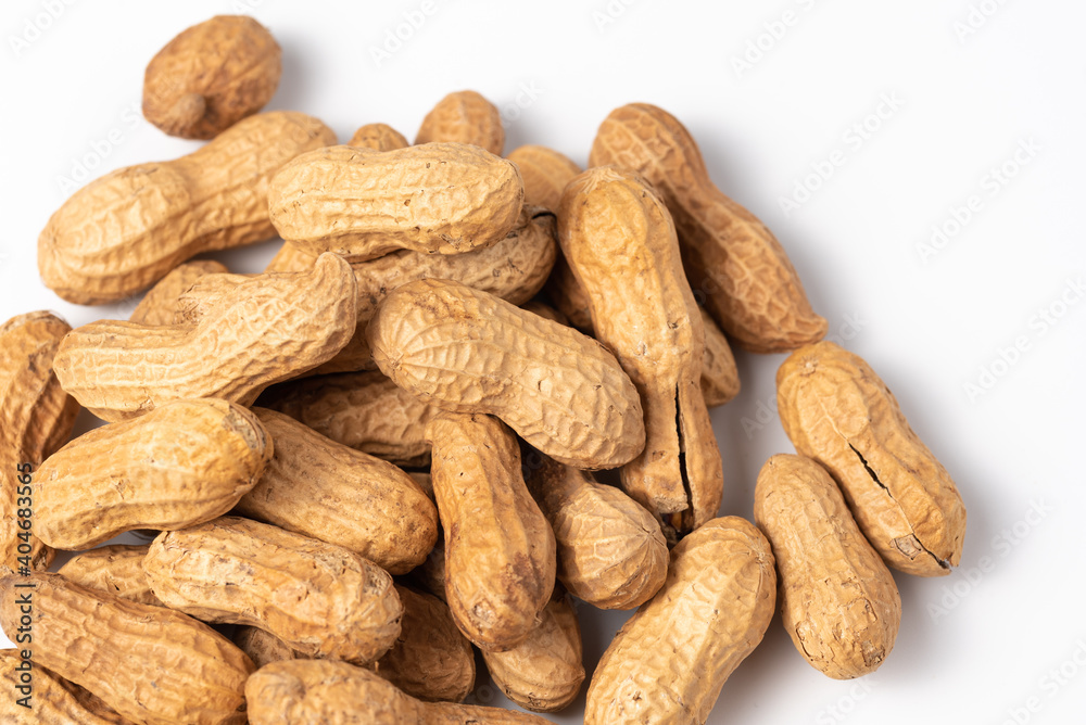 Dried peanuts closeup isolated on white background. Food theme Dried peanuts closeup isolated on white background. Food theme