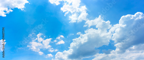 sky and clouds background bright day light in blue sky with white fluffy clouds