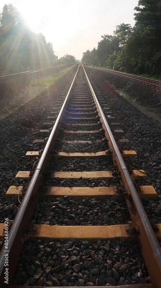 Fototapeta premium Railroads with yellow pads of concrete and pebbles around it