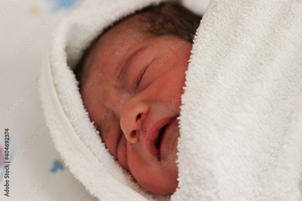 Newborn child in a towel Newborn child in a towel