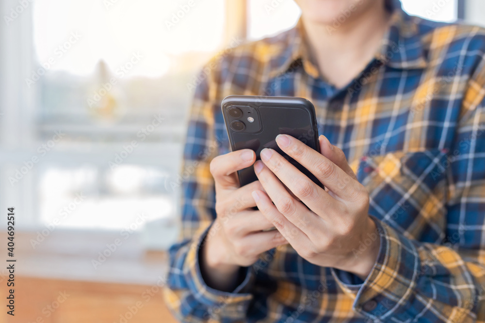 using cell phone hand holding mobile texting message contact us.chatting,search internet information in office.technology device communication connecting using cell phone hand holding mobile texting message contact us.chatting,search internet information in office.technology device communication connecting