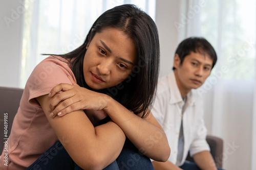 Asian women are disappointed and saddened after an argument with their husband. Asian couples are having family problems resulting in divorce. Love problem