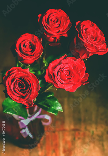 Fototapeta Naklejka Na Ścianę i Meble -  Bouquet of red roses with raindrops. Close up. Selective focus. Beautiful 