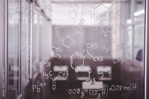 Chemistry background - molecule models and formulas, hand-drawn on glass background