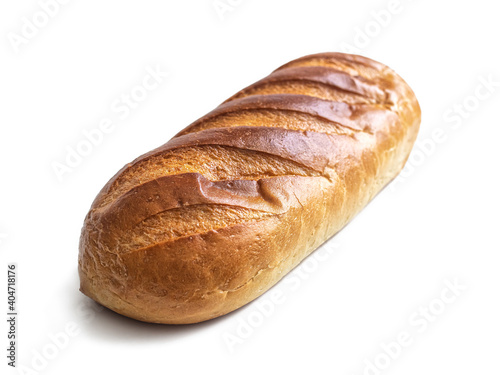 Loaf with golden crust and notches on top on a white background