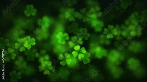 Abstract Motion Green Shiny Blurry Sharp Four And Three Clover Leaves Saint Patrick's Day With Glitter Sparkles Dust Background Seamless Loop Animation photo