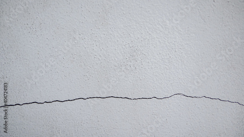 Cracks on the cement wall. ...