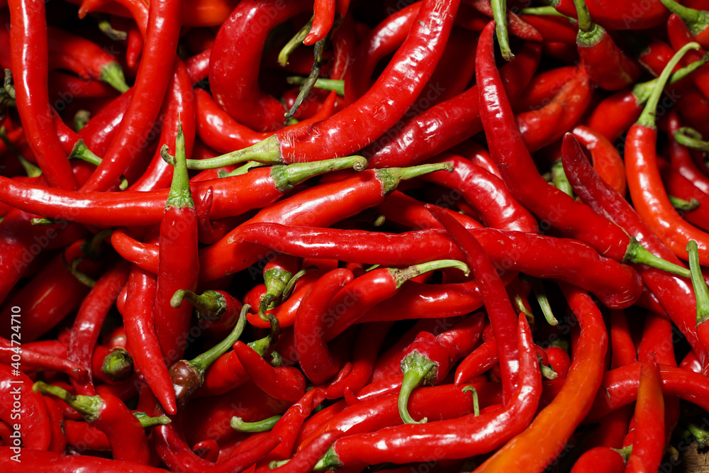 Red Chillies Background, Selective focus. red Chili is a vegetable that is spicy and popular in Asia. Top View Pile of Fresh Chili for Sale in The Market. Template to mock up or input Text.