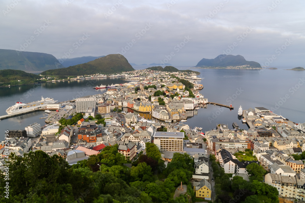 Iconic buildings along the shoreline of Alesund Norway from above