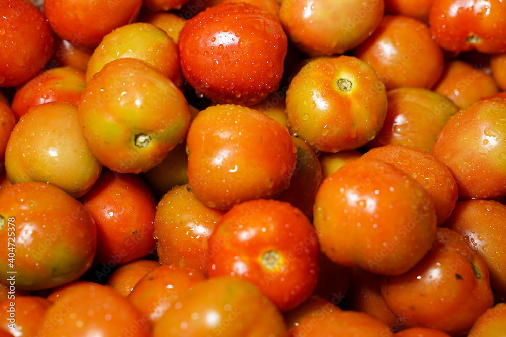 Delicious red tomatoes it can be used as background. (selective focus). Tomato vegetable concept space for banner top view. Tomatoes for background. Healthy eyes with regular consumption of tomatoes.