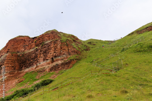 Scenery along the iconic red cliffs of Helgoland in the Waddell Sea off the coast of Germany photo