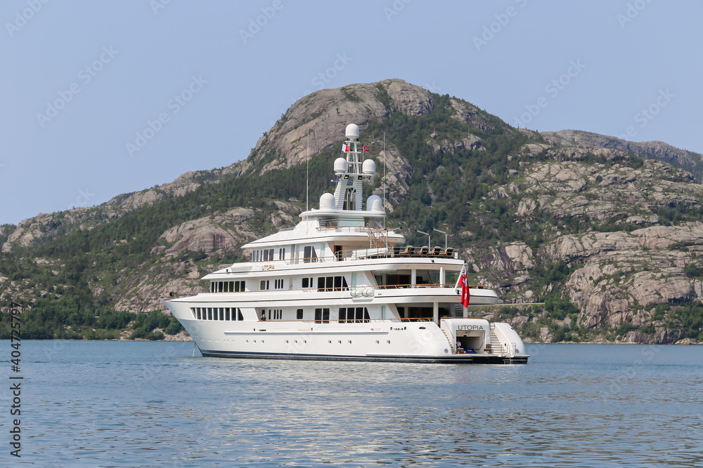 Mega yachtanchored off the shores of Gerainger in the fjords of Norway Mega yachtanchored off the shores of Gerainger in the fjords of Norway