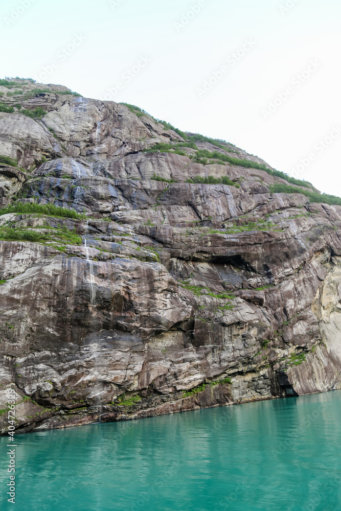 Rock faces along the fjord cliffs and seaside walls of Noway