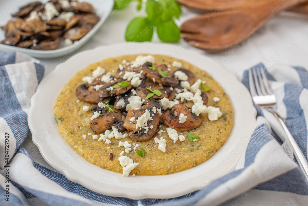 Traditional polenta with mushrooms and cheese Traditional polenta with mushrooms and cheese