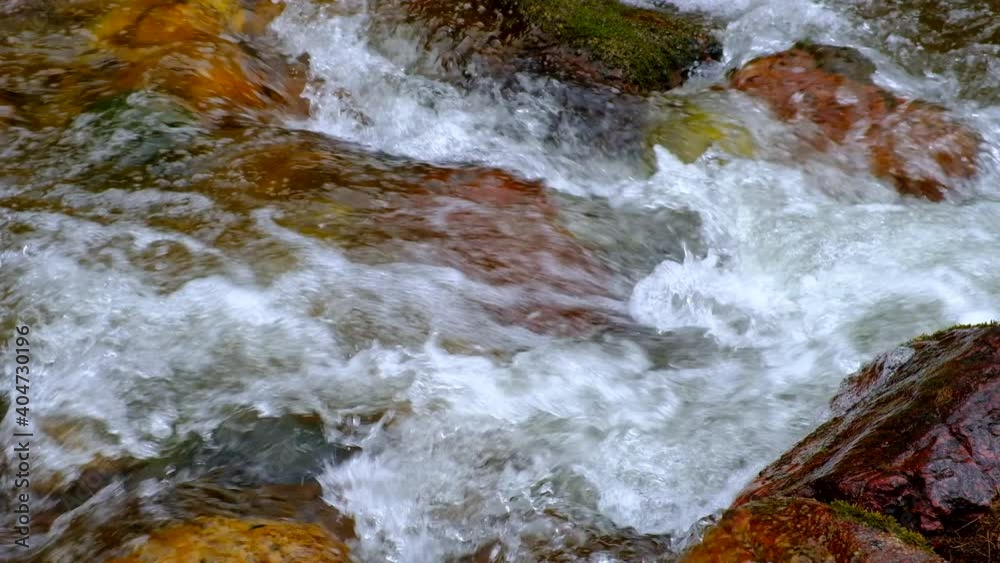 Mountain river flow on green colorful background. Spring season. Sunny day. Mountain river water landscape. Summer landscape. Wild nature. Mountain river flow on green colorful background. Spring season. Sunny day. Mountain river water landscape. Summer landscape. Wild nature.