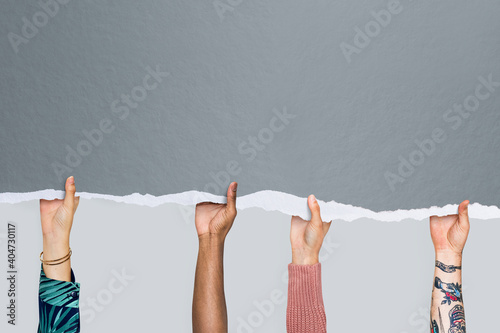 People's hands holding gray ripped paper mockup photo